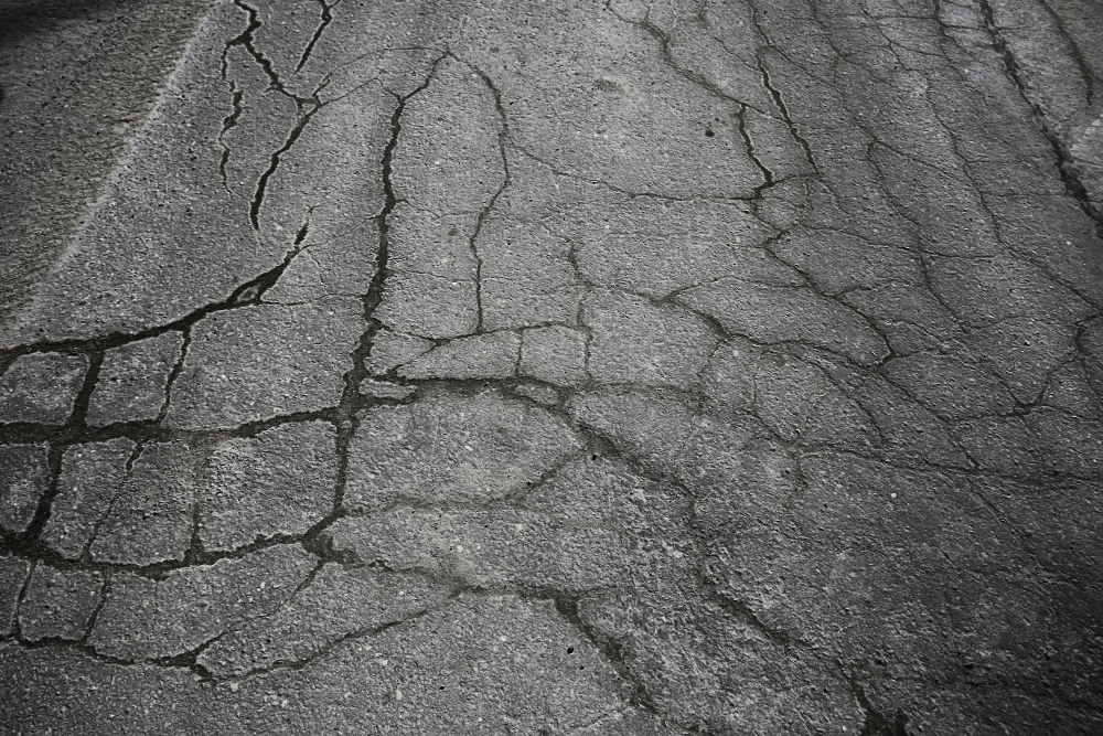 How to Prevent Asphalt Cracks with Expert Sealcoating