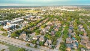 Aerial view of a residential neighborhood in North Texas featuring long driveways and suburban homes served by PMG Paving.